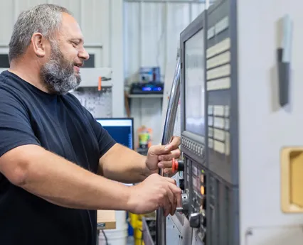 Veit Tool Employee Working at a Precision Metalworking Machine Veit Tool Employee Working at a Precision Metalworking Machine